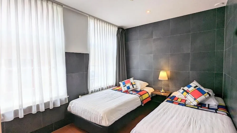 Bed in The Amsterdam Hotel Apartment in the Center