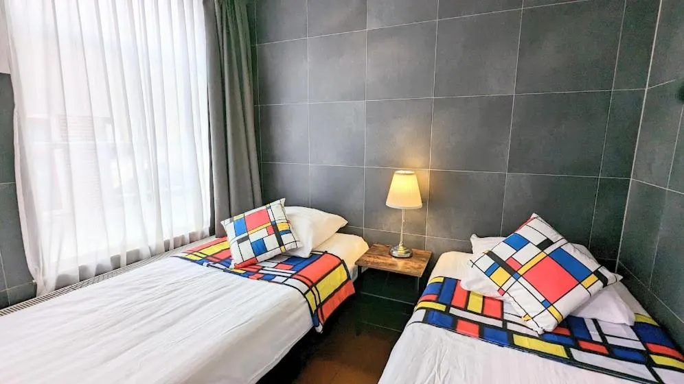 Bed in The Amsterdam Hotel Apartment in the Center