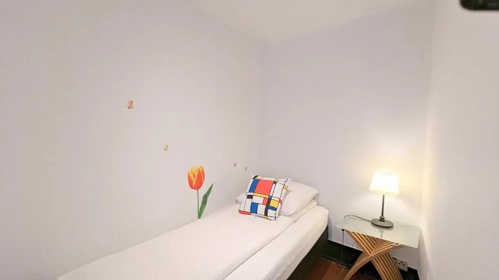 Bed in The Amsterdam Hotel Apartment in the Center