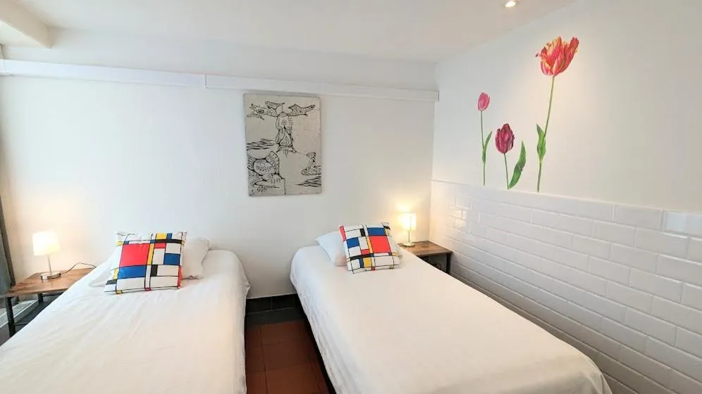 Bed in The Amsterdam Hotel Apartment in the Center