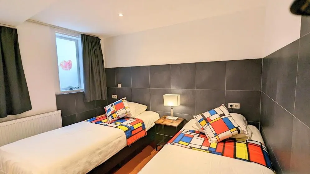 Bed in The Amsterdam Hotel Apartment in the Center