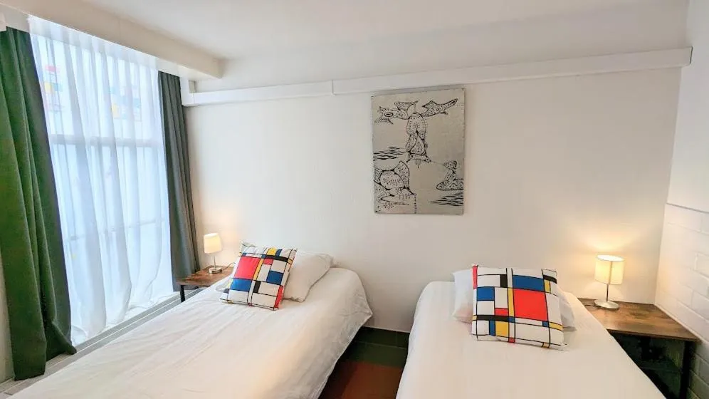 Bed in The Amsterdam Hotel Apartment in the Center