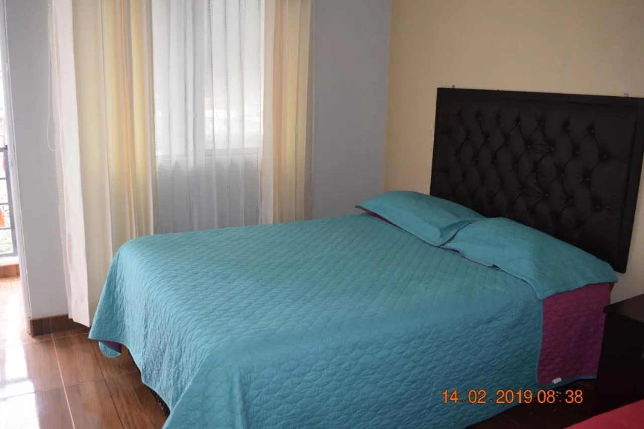 Bed in Arum Qurpawasi Hospedaje