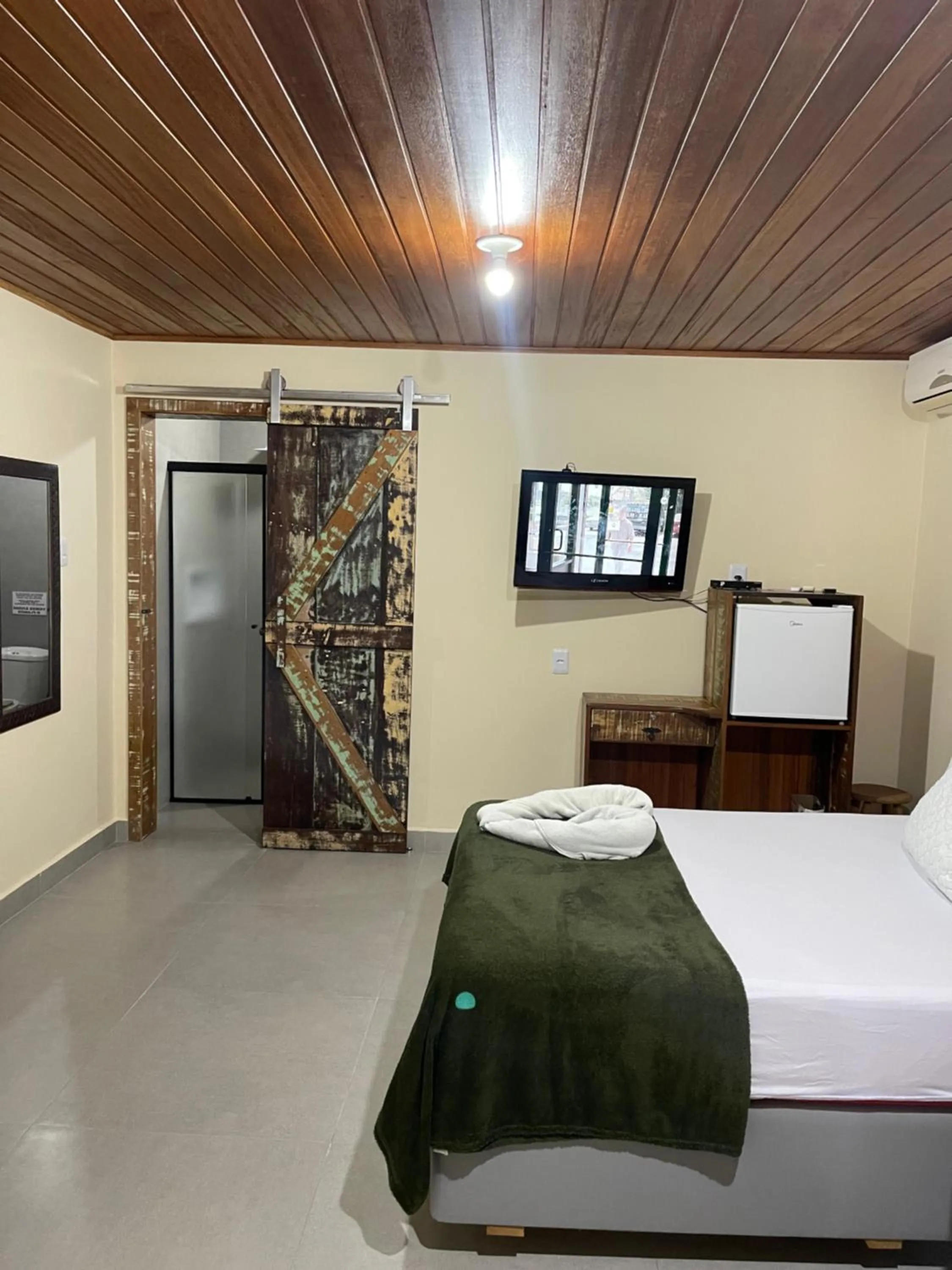 Bed in Pousada Quatro Estrelas