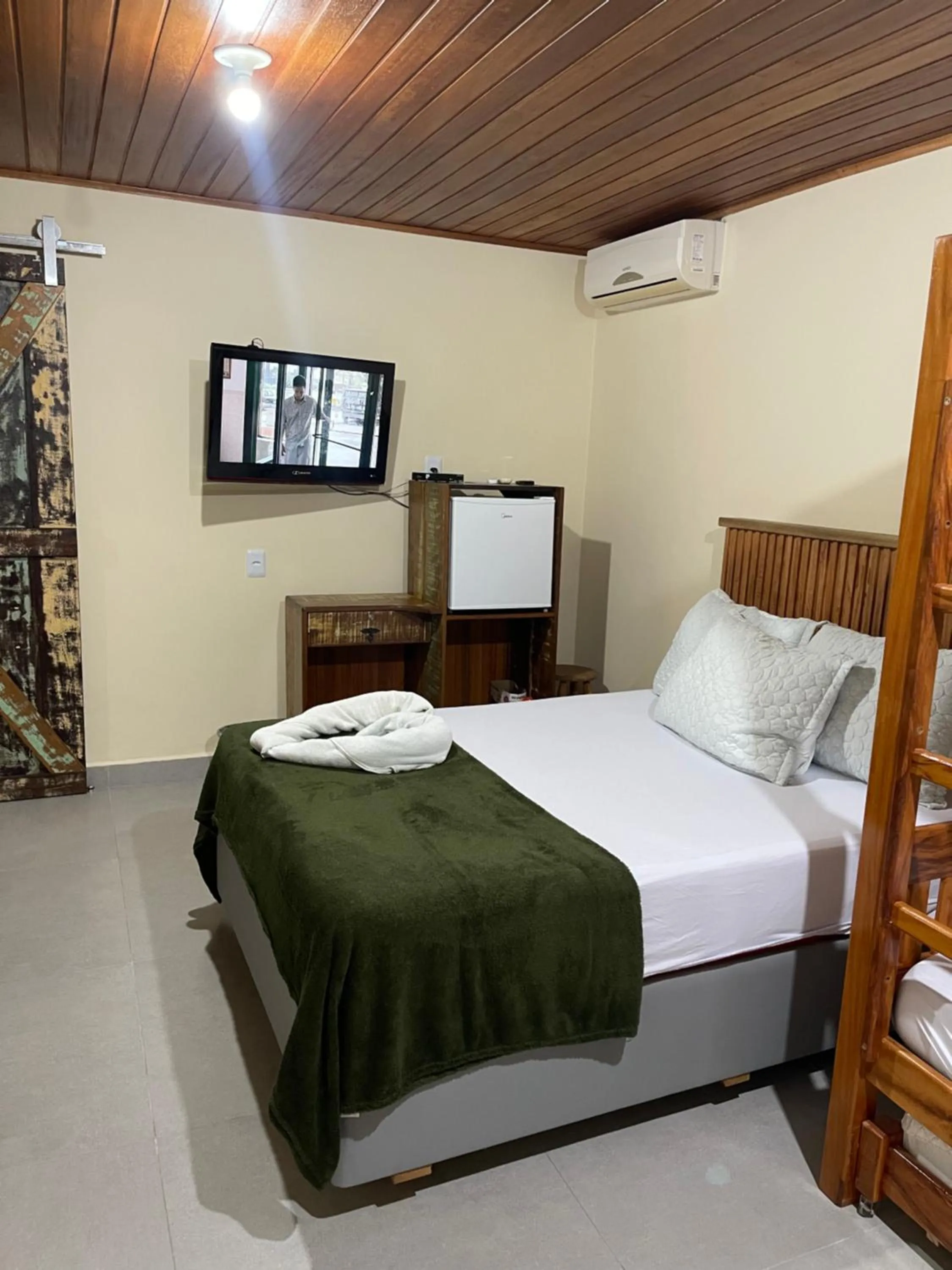 Bed in Pousada Quatro Estrelas