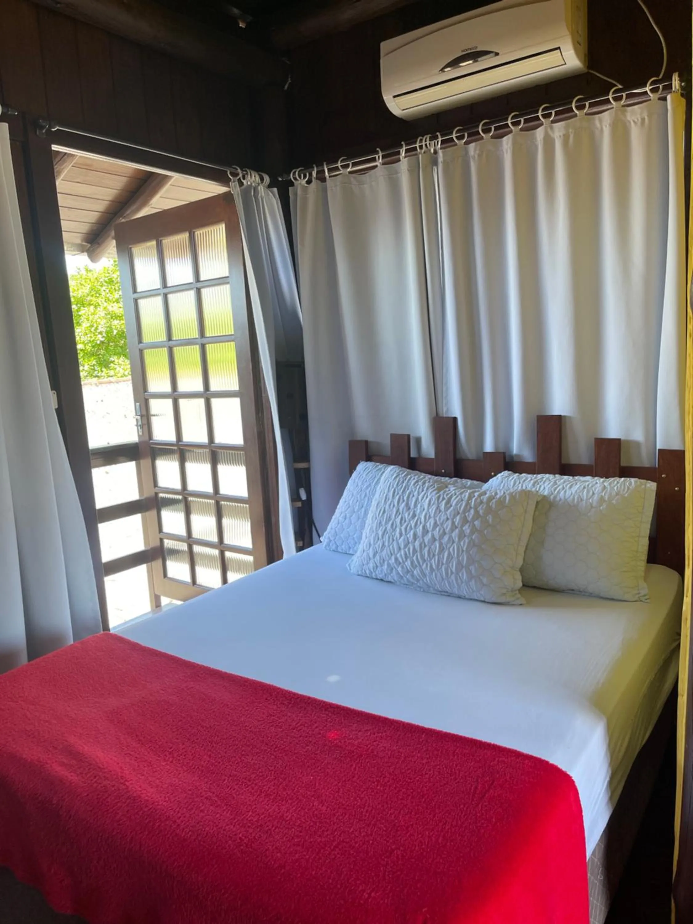 Bed in Pousada Quatro Estrelas