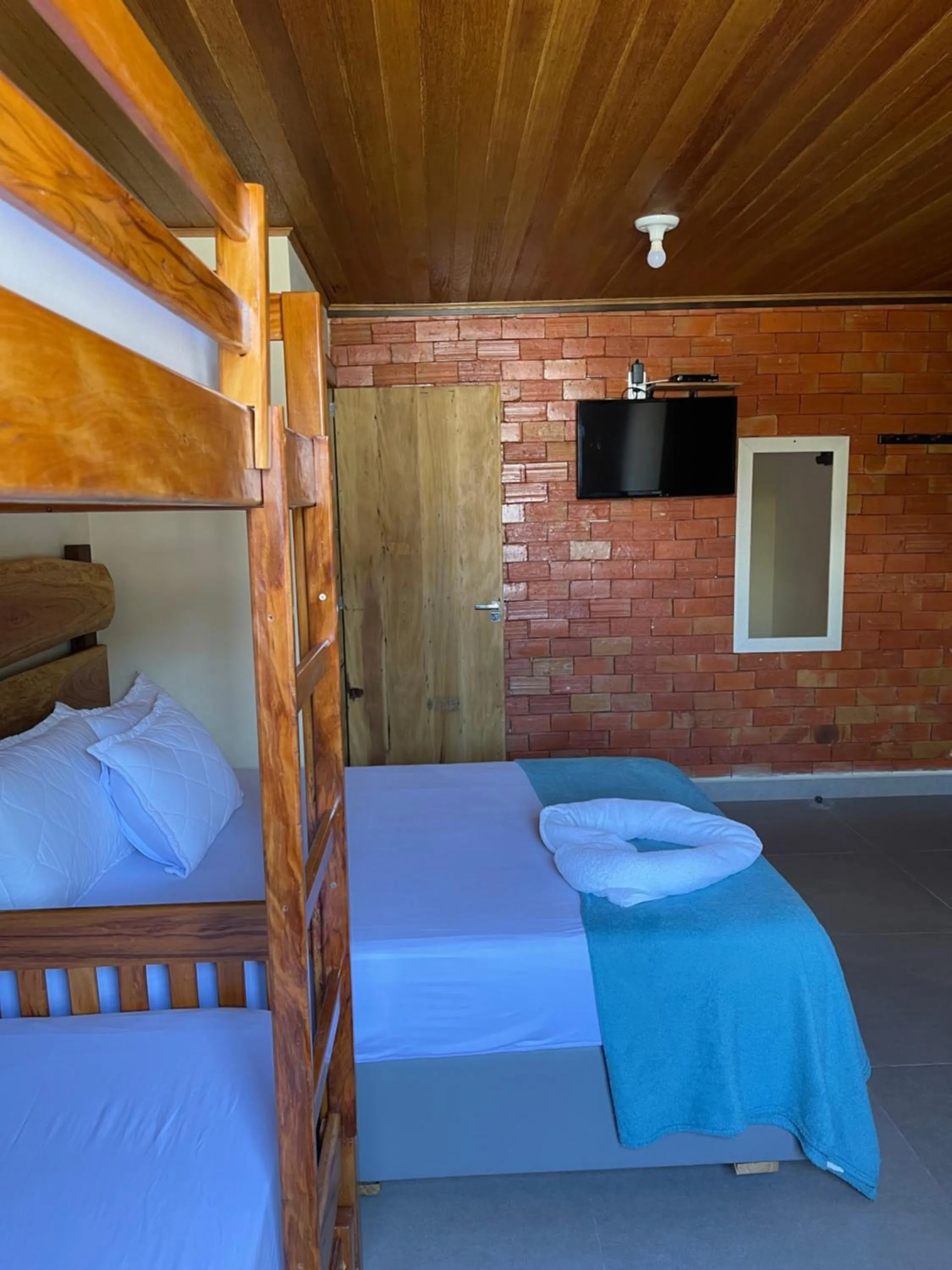 Bed in Pousada Quatro Estrelas