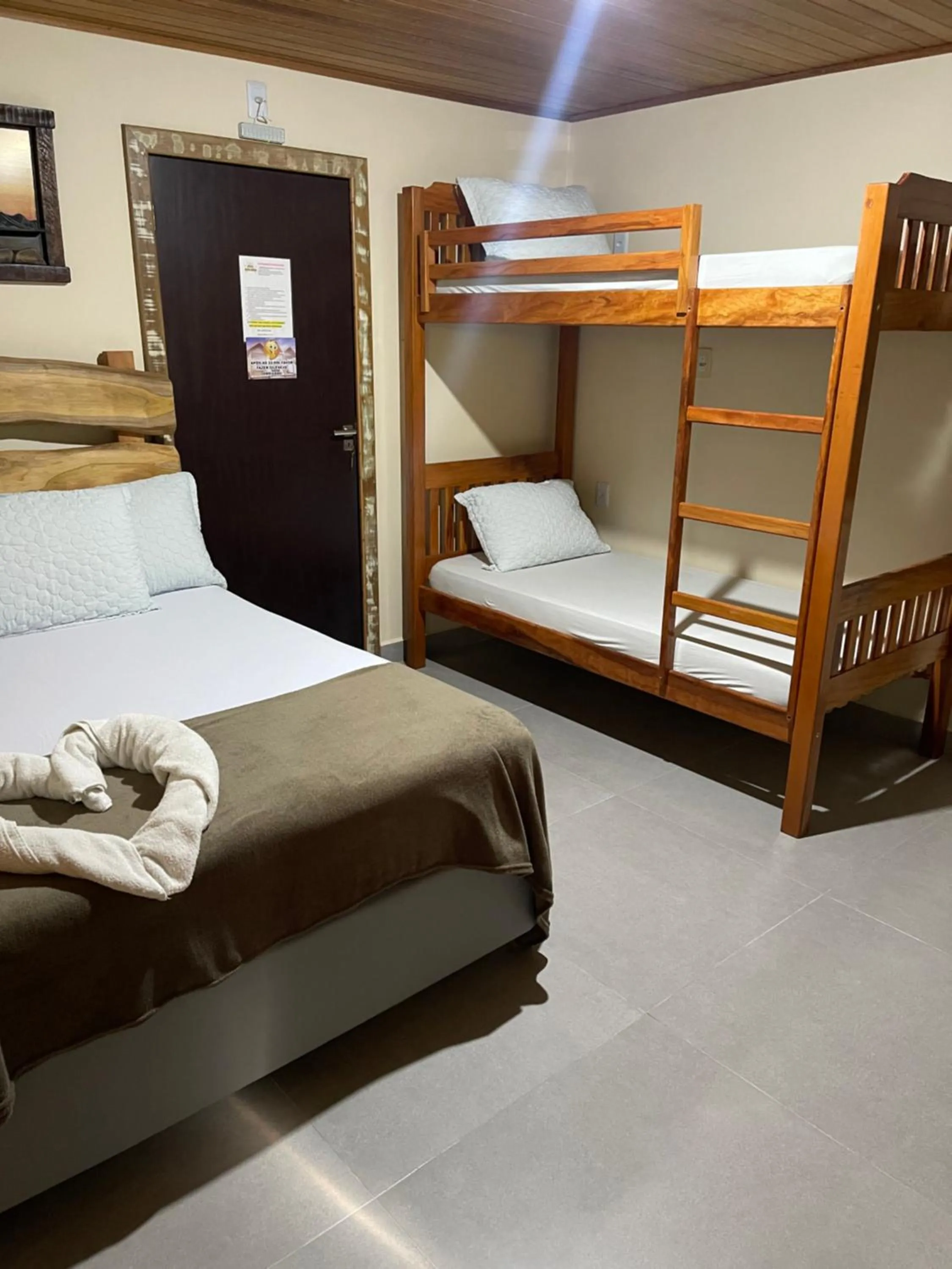 Bed in Pousada Quatro Estrelas