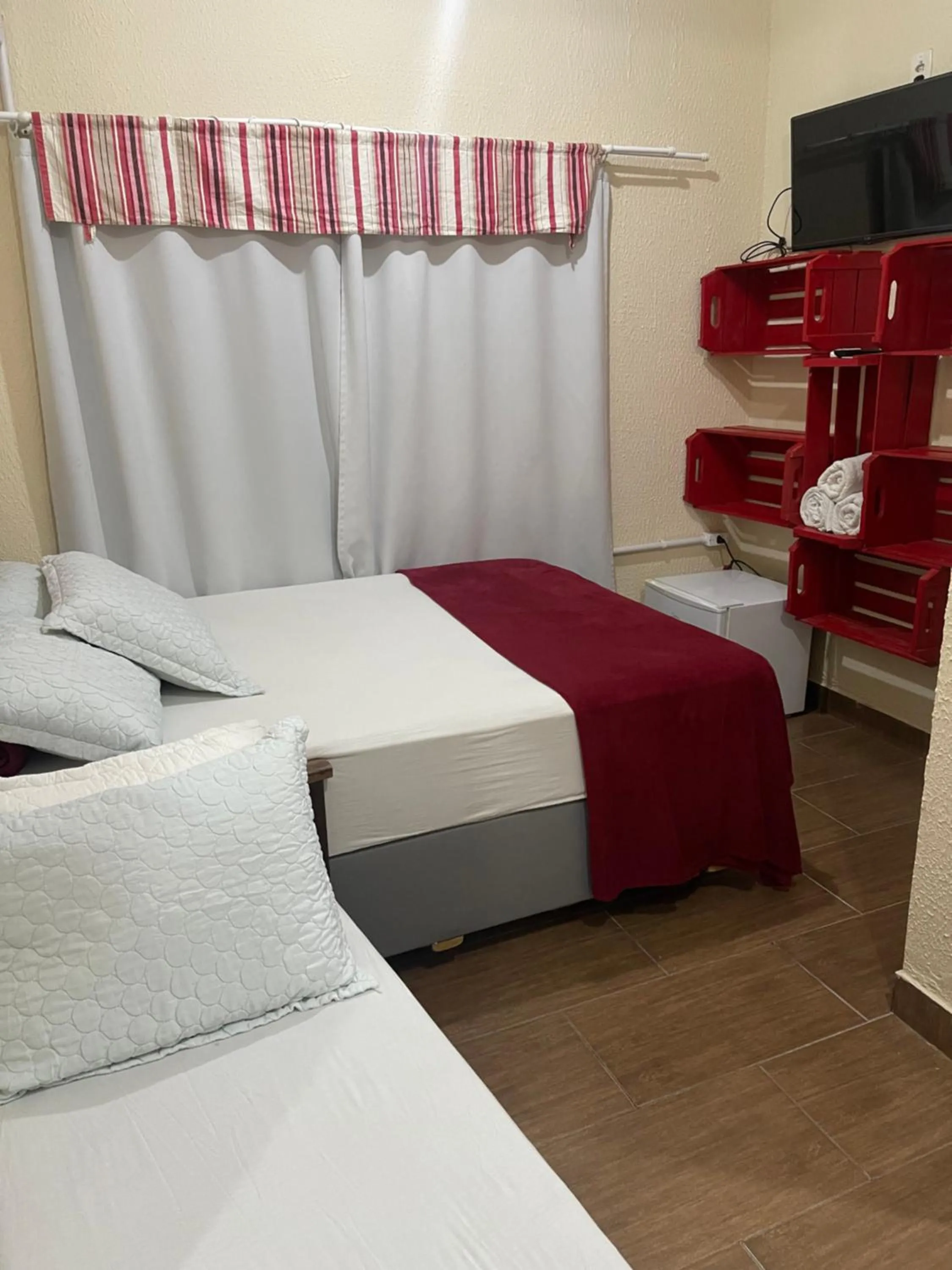 Bed in Pousada Quatro Estrelas