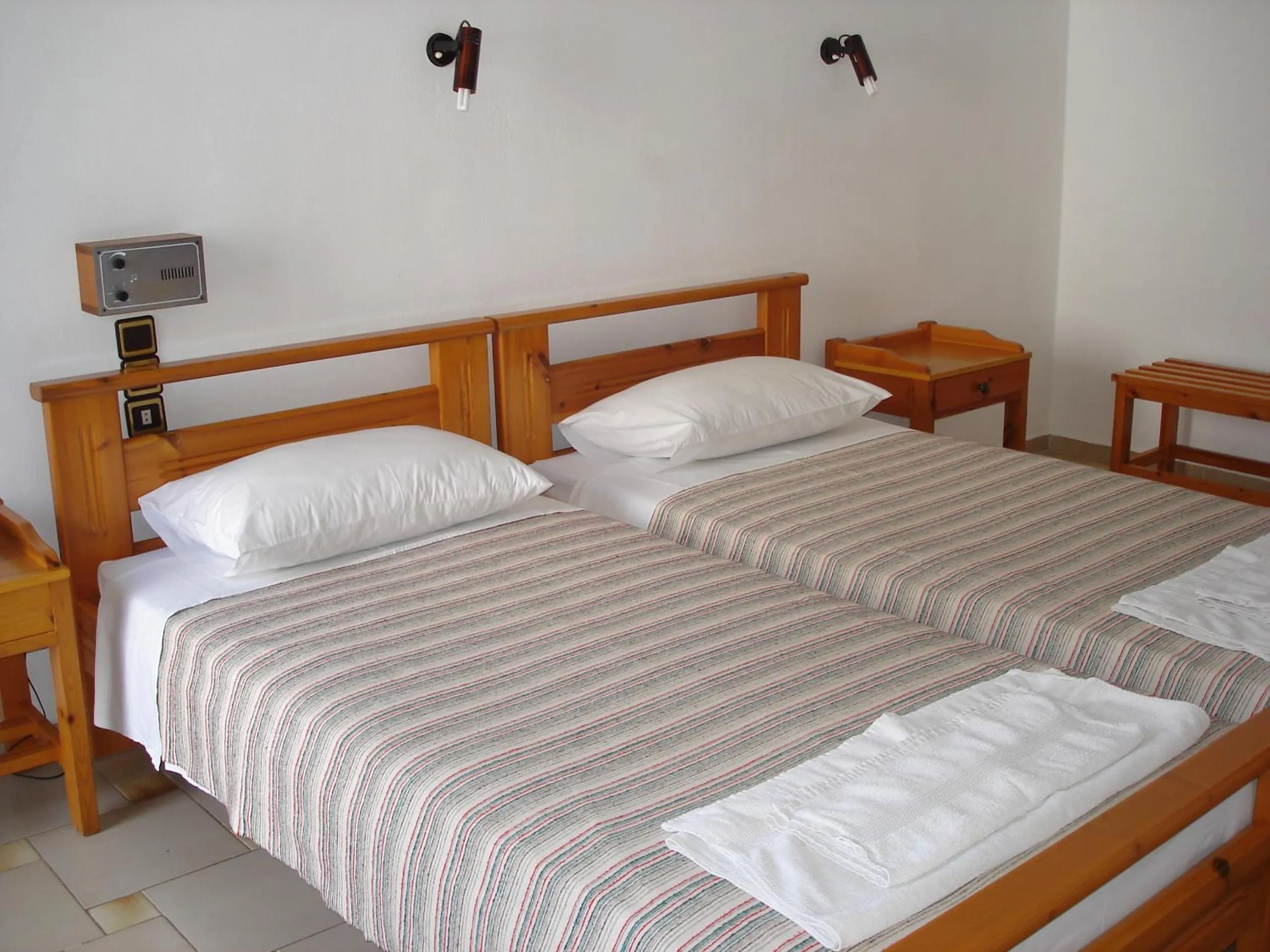 Bed in Popi Hotel Apartments