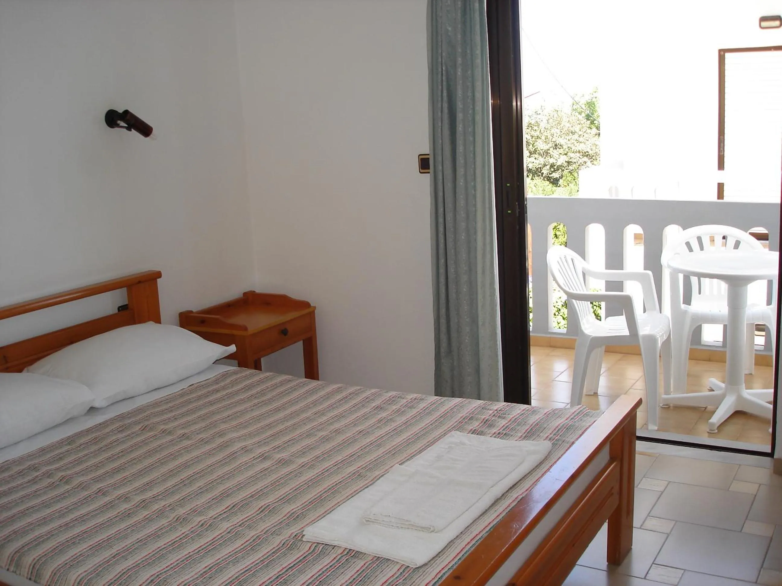 Bed in Popi Hotel Apartments