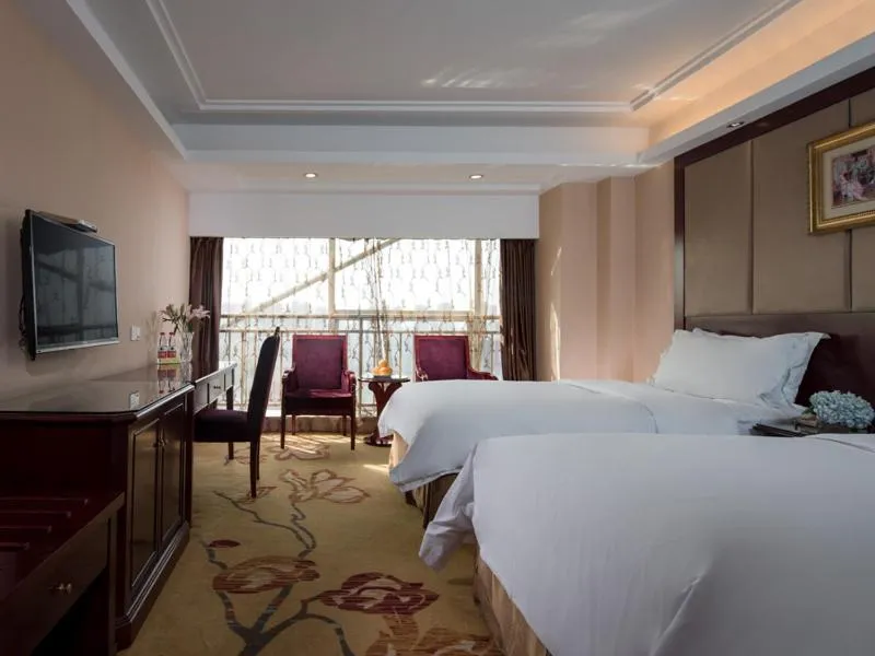 Bed in Vienna International Hotel Changzhou Hutang