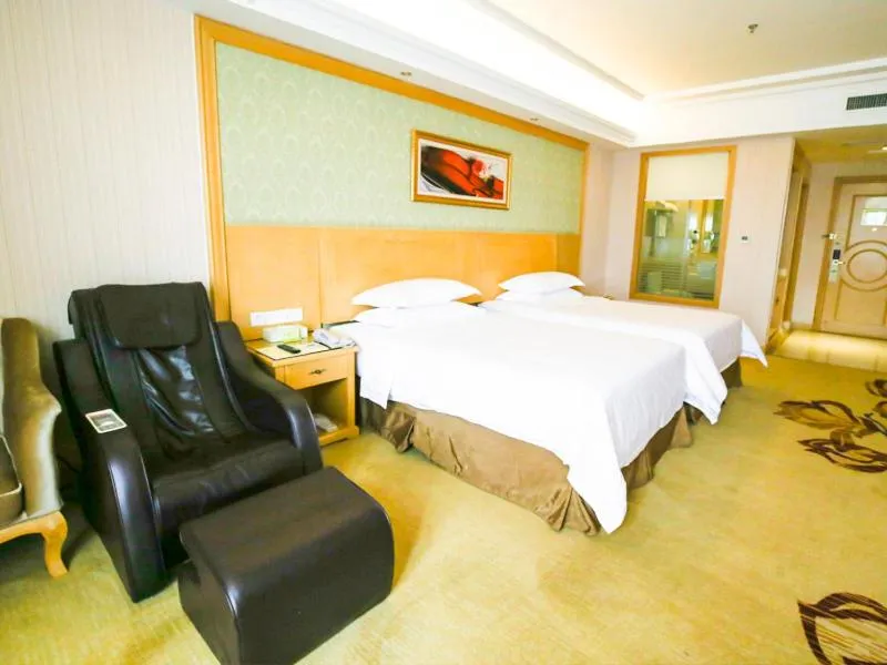 Bed in Vienna Hotel Jiangsu Xuzhou Pengcheng Square