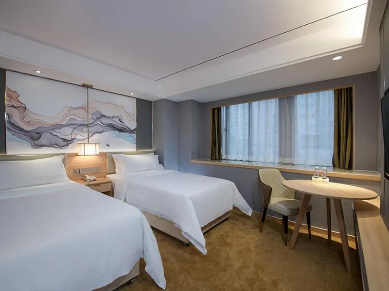 Bed in Vienna Hotel Shenzhen Exibition Center