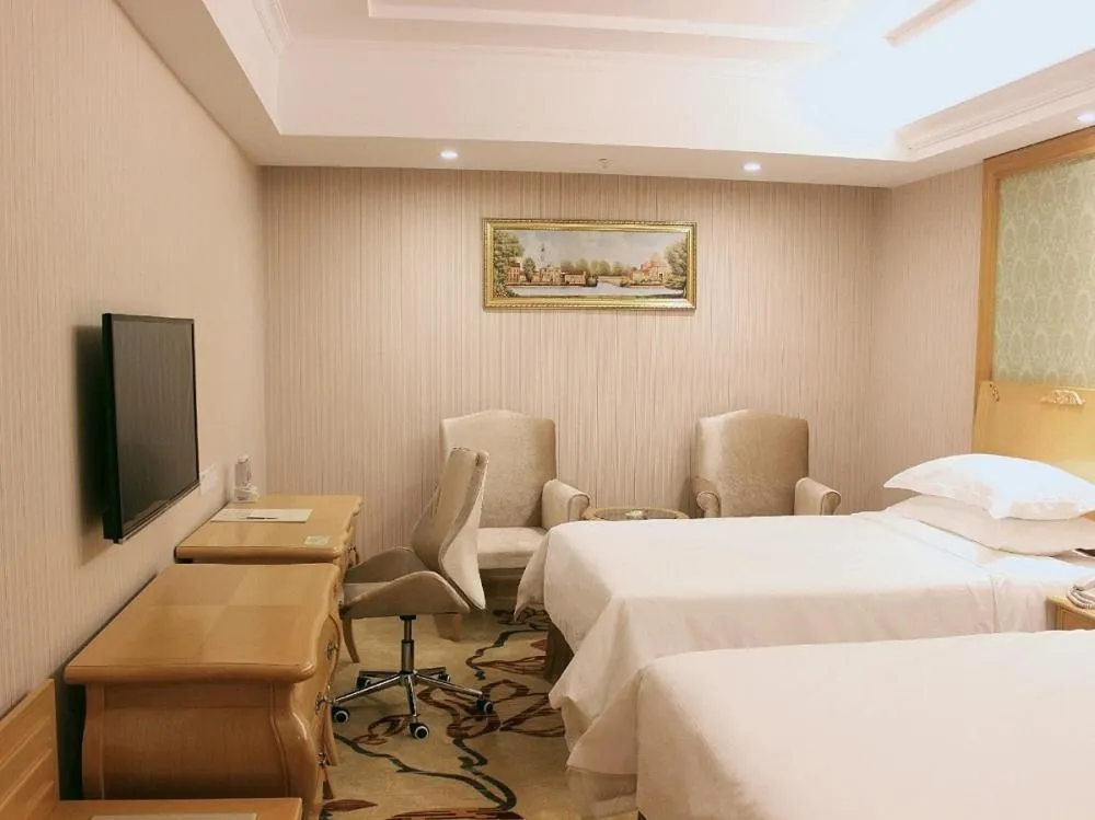 Bed in Vienna Hotel Shenzhen Nanshan Yilida