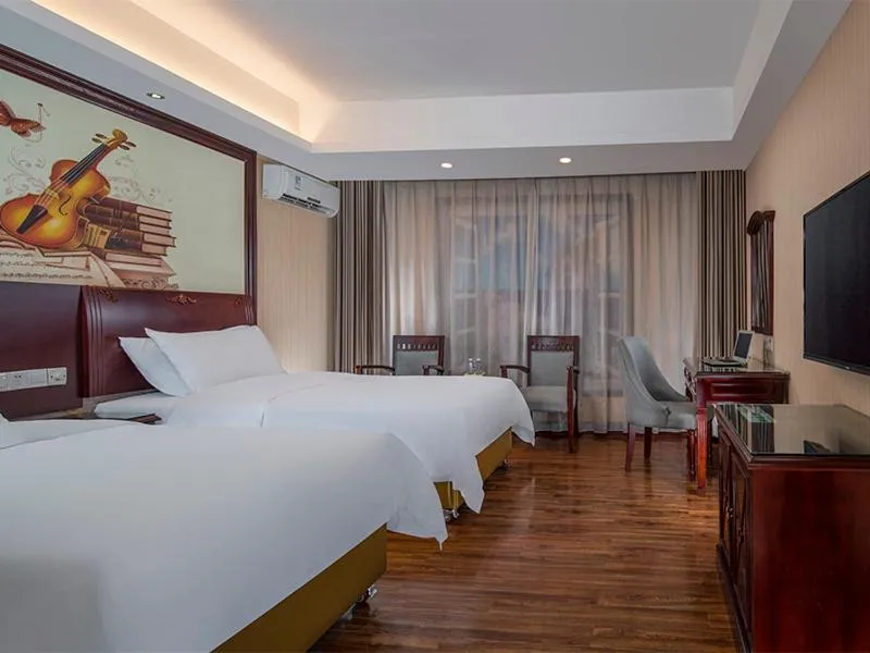 Bed in Vienna Hotel Shenzhen Shangjin Center