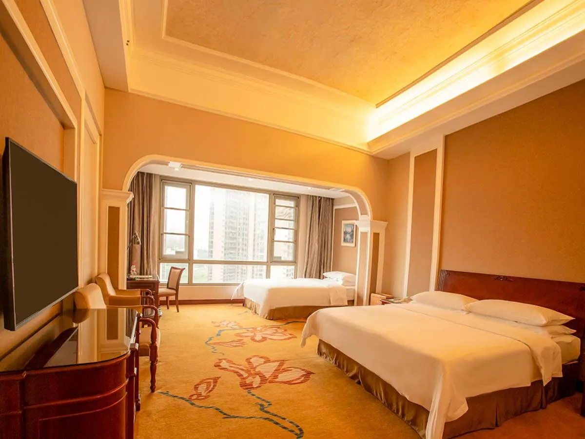 Bed in Vienna Hotel Shenzhen Songgang Liye Road