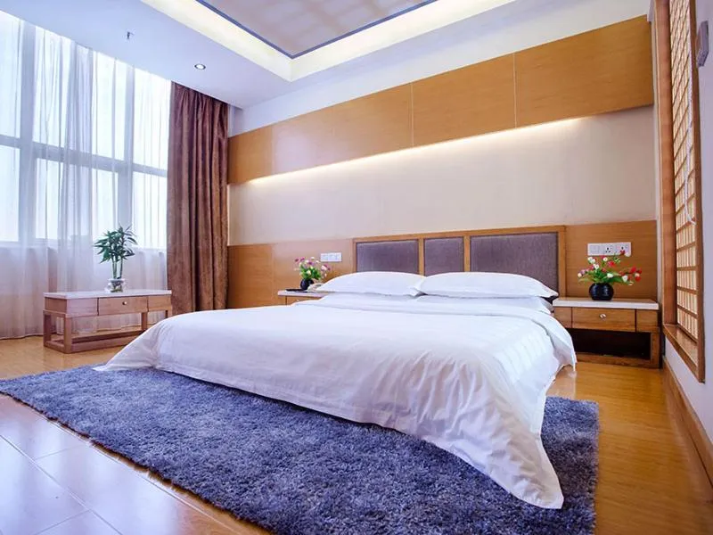 Bed in Vienna International Hotel Shenzhen Songgang Wanzhao Square
