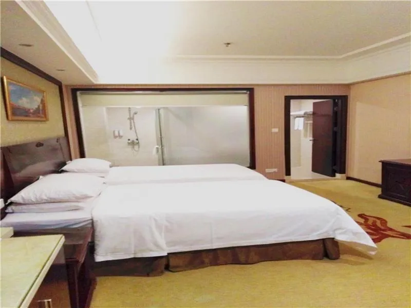 Bed in Vienna Hotel Shenzhen Shajing Shangnan