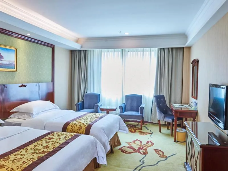 Bed in Vienna Hotel Shenzhen Shajing Shangnan