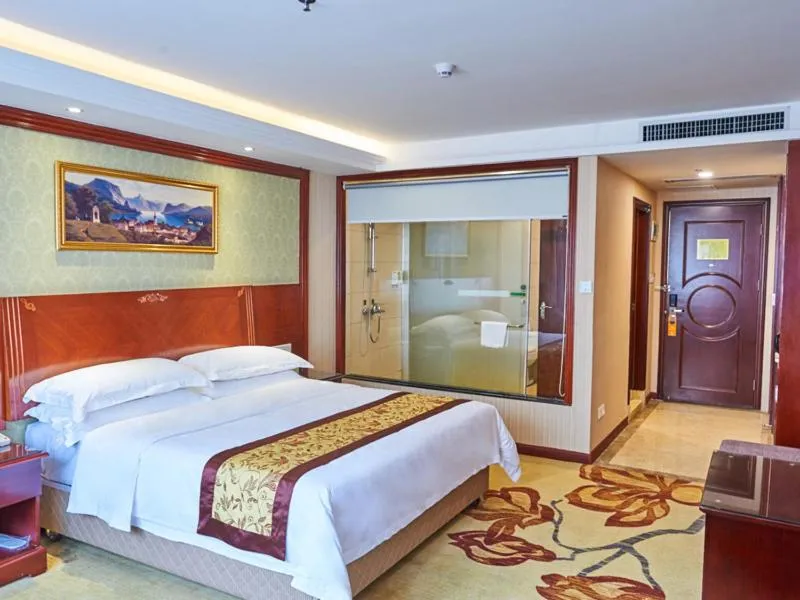 Bed in Vienna Hotel Shenzhen Shajing Shangnan