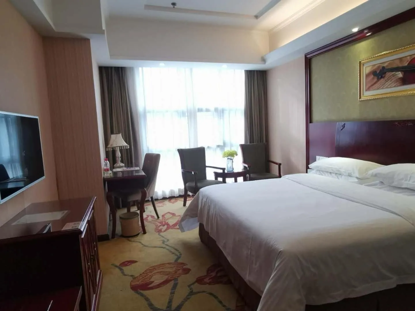 Bed in Vienna Hotel Chaozhou Plaza