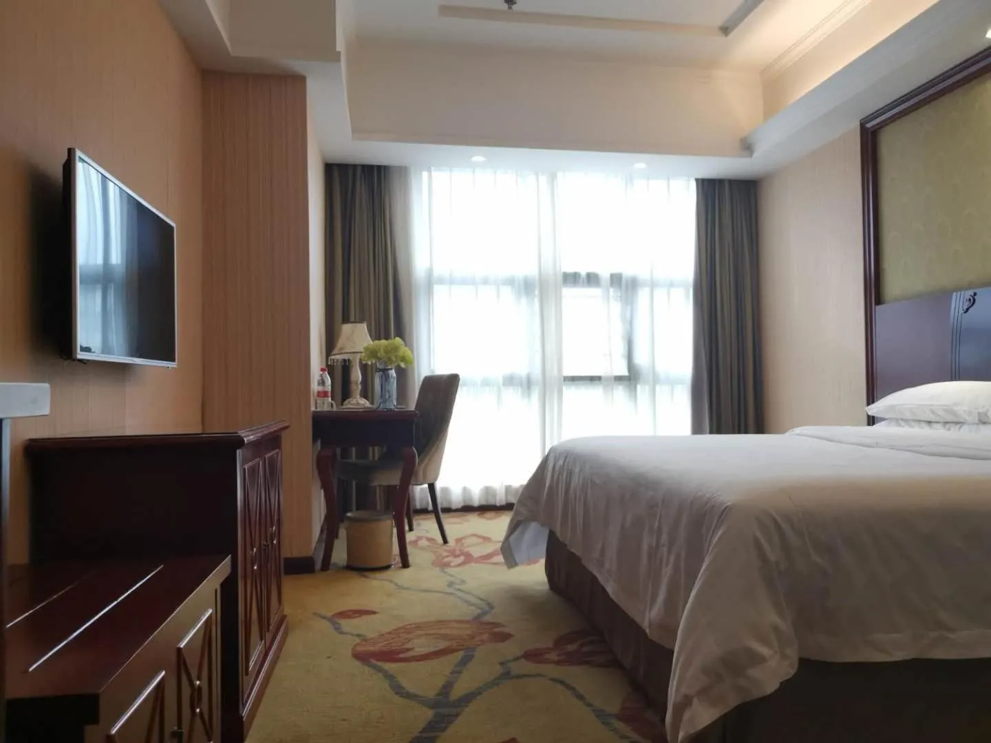 Bed in Vienna Hotel Chaozhou Plaza