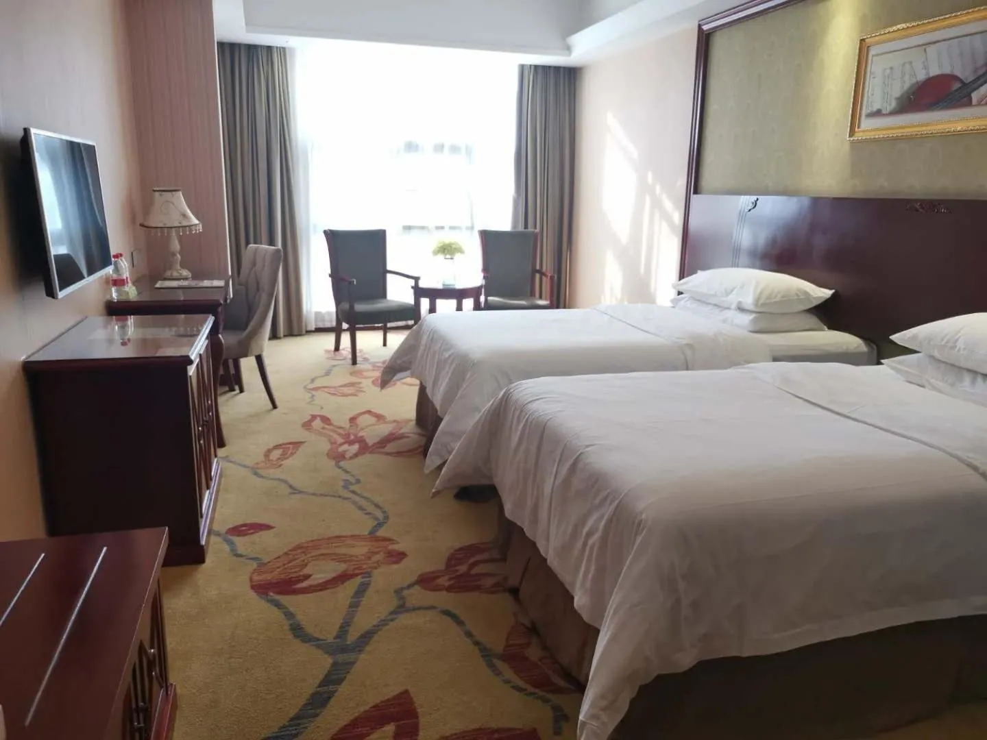 Bed in Vienna Hotel Chaozhou Plaza