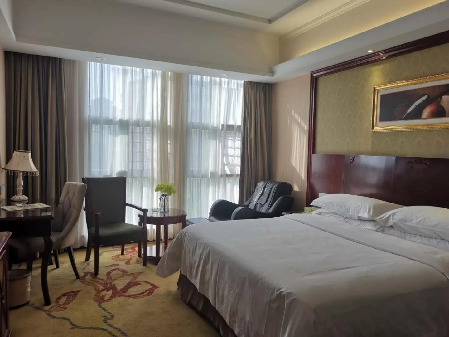 Bed in Vienna Hotel Chaozhou Plaza