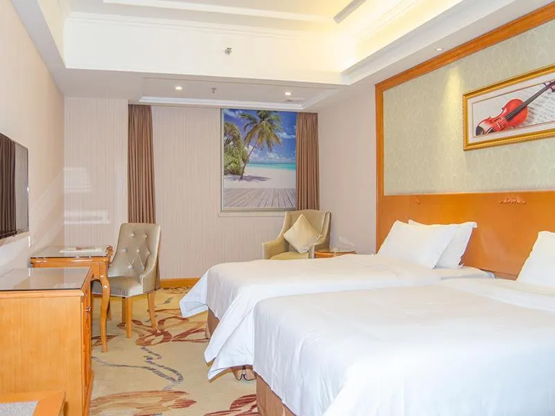 Bed in Vienna Hotel Dongguan Mayong Centre Avenue