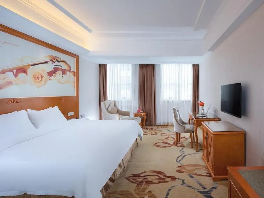 Bed in Vienna Hotel Dongguan Mayong Centre Avenue