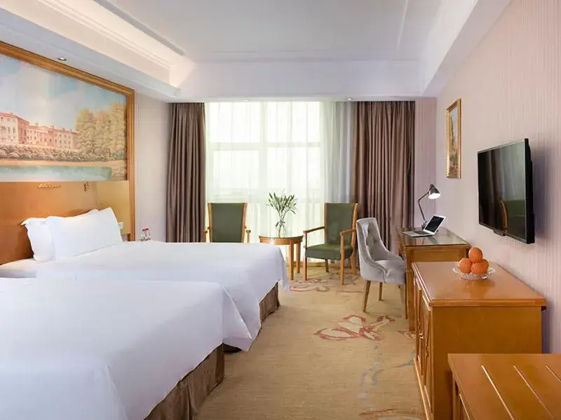 Bed in Vienna Hotel HaiNan Oriental Avenue Bed in Vienna Hotel HaiNan Oriental Avenue