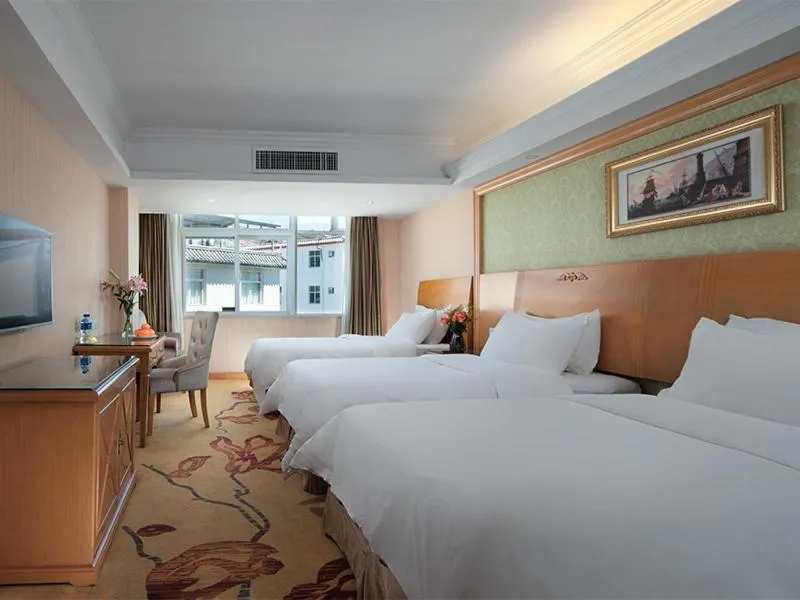 Bed in Vienna International Hotel Lijiang Yuxue Avenue