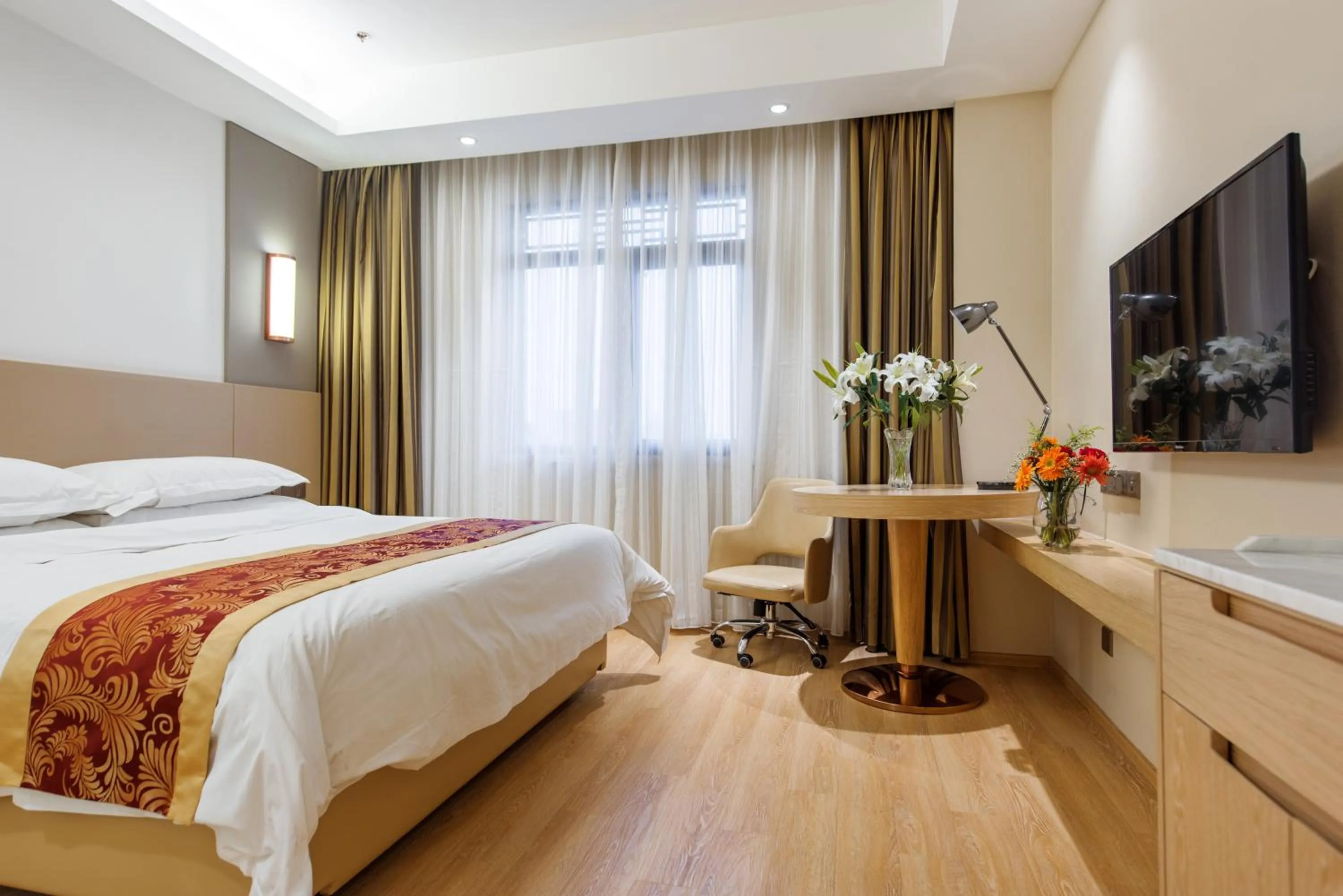 Bed in Vienna International Hotel Xi'an Dayan Tower