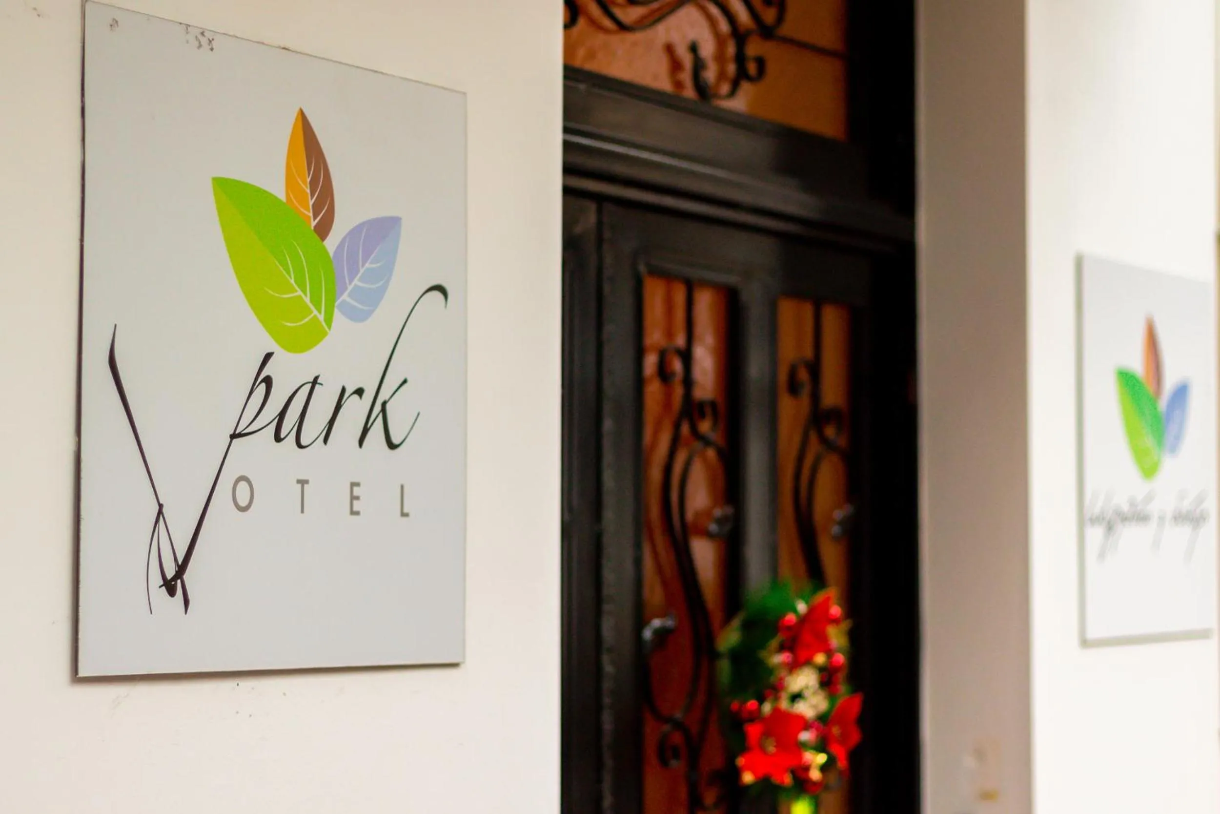 Property logo or sign in V Park Hotel