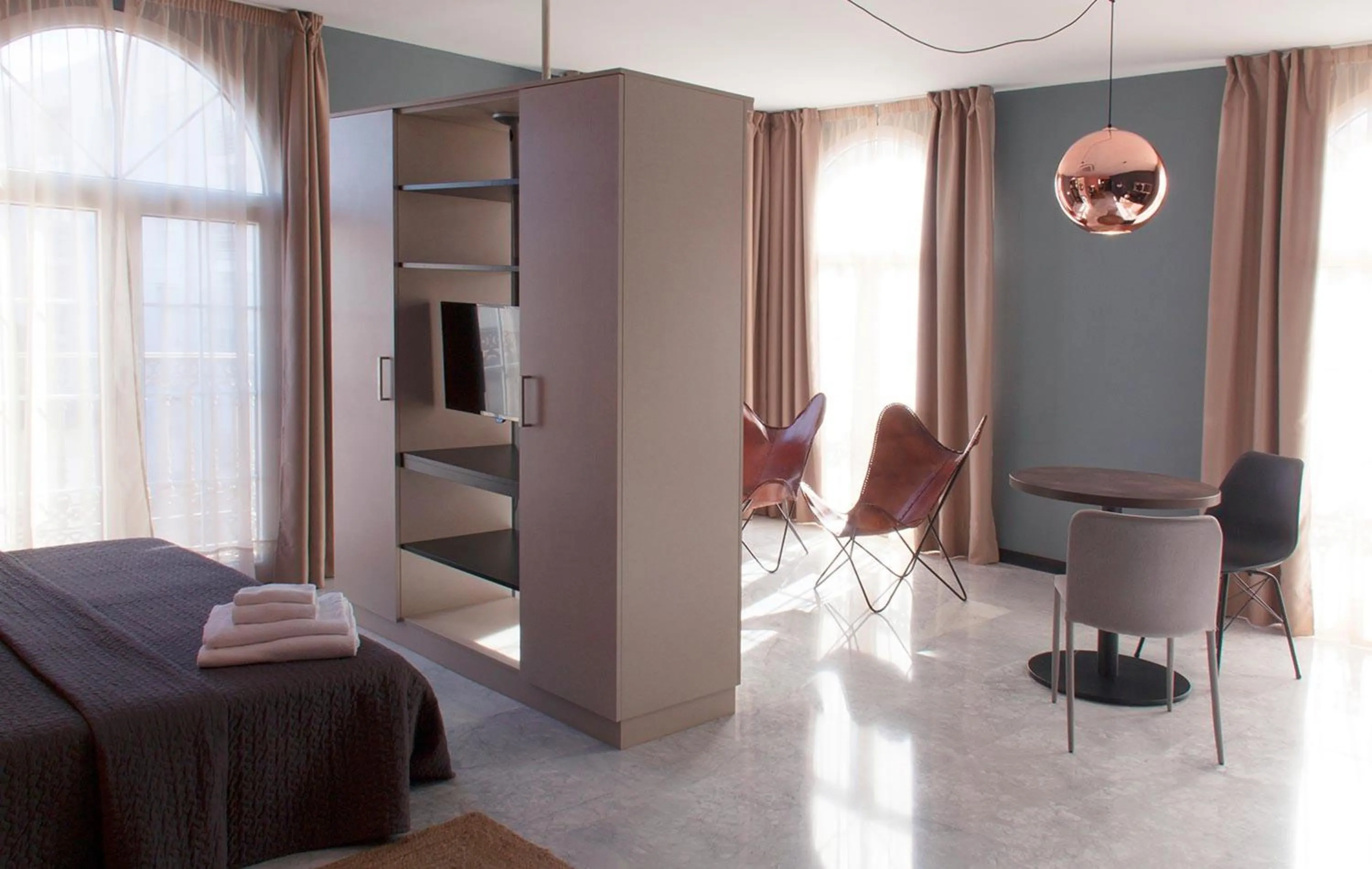 Living room, Bed in Apartamentos NONO by Charming Stay