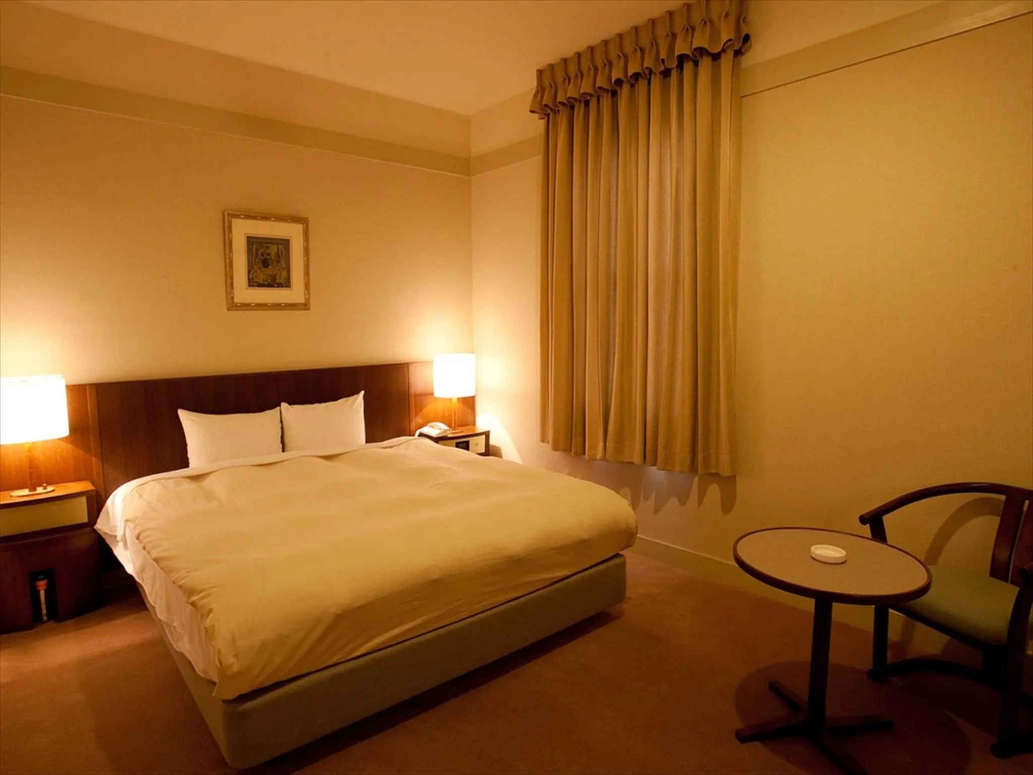 Bed in Yugashima Golf Club & Hotel Resort