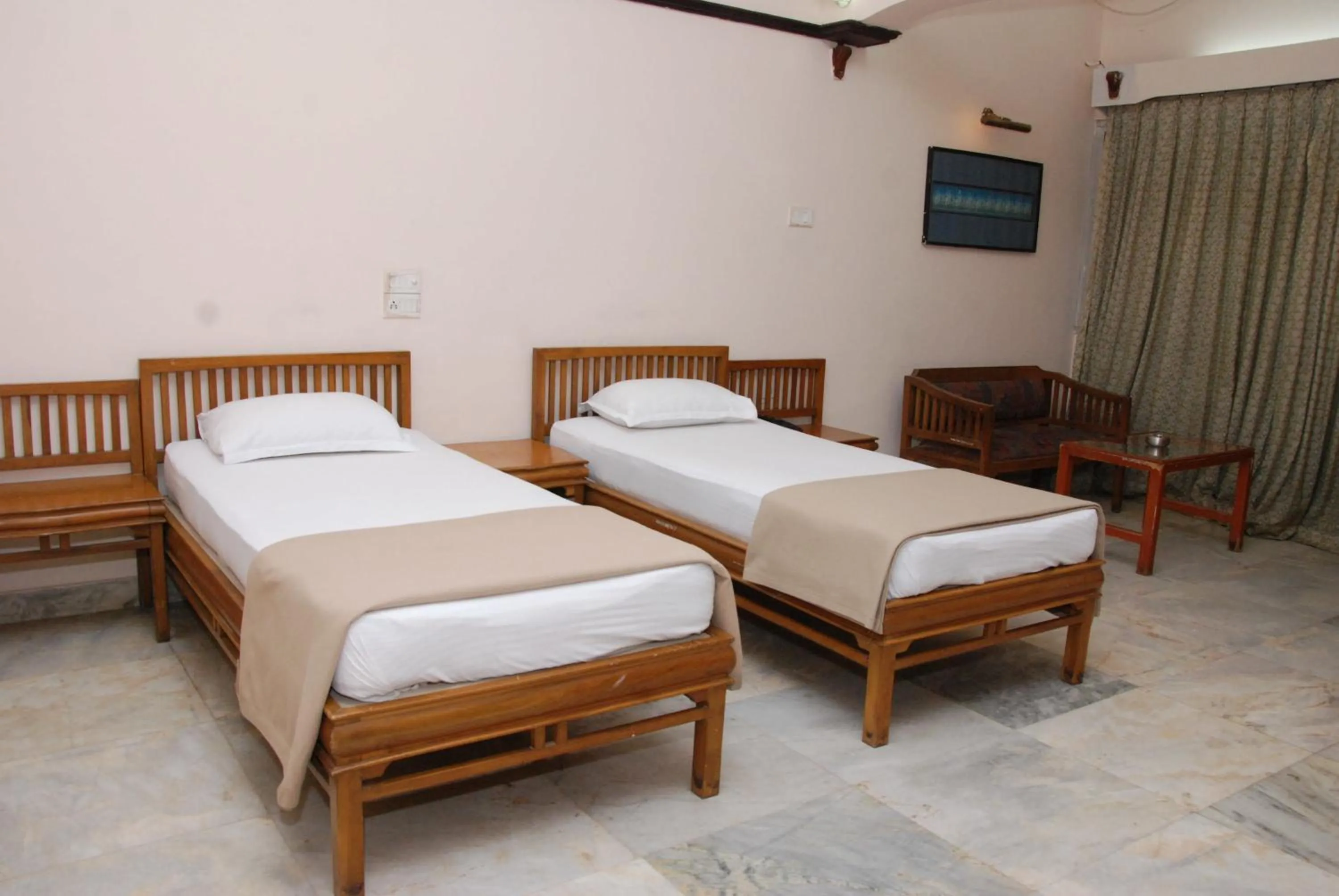 Bed in Amogha International Hotel