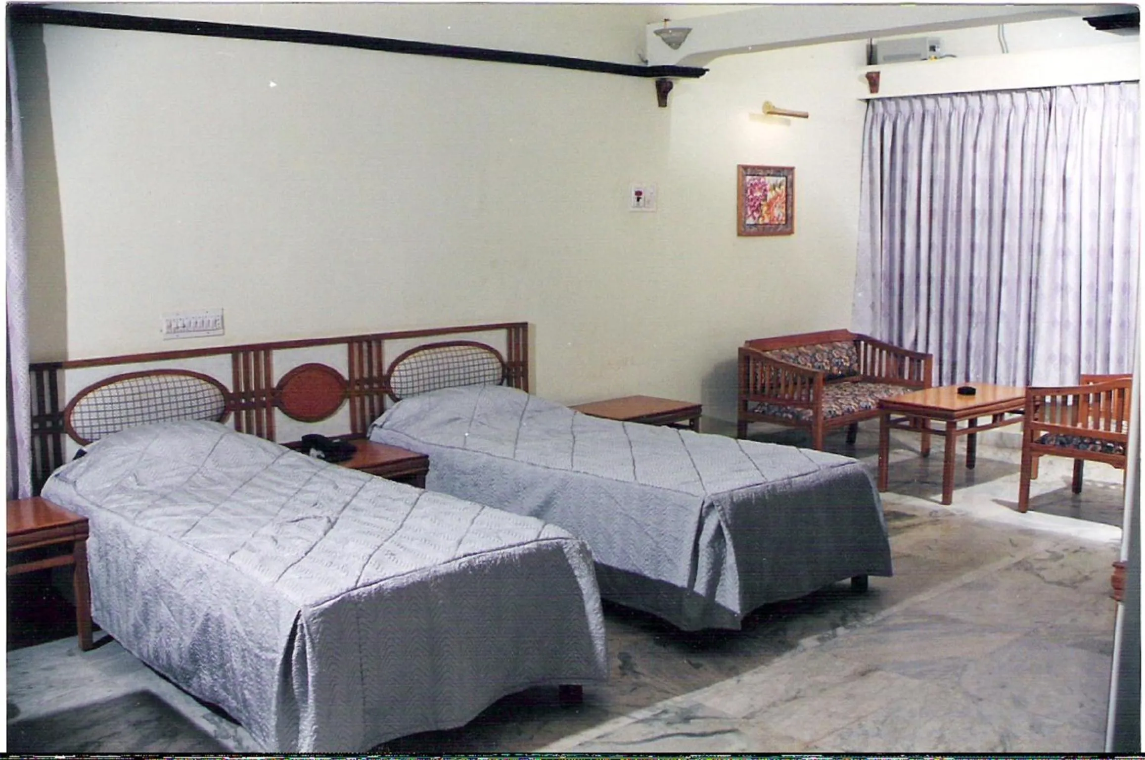 Bed in Amogha International Hotel