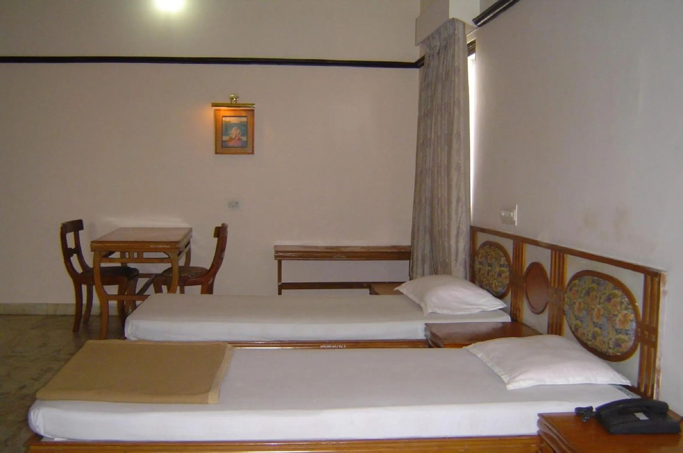 Bed in Amogha International Hotel