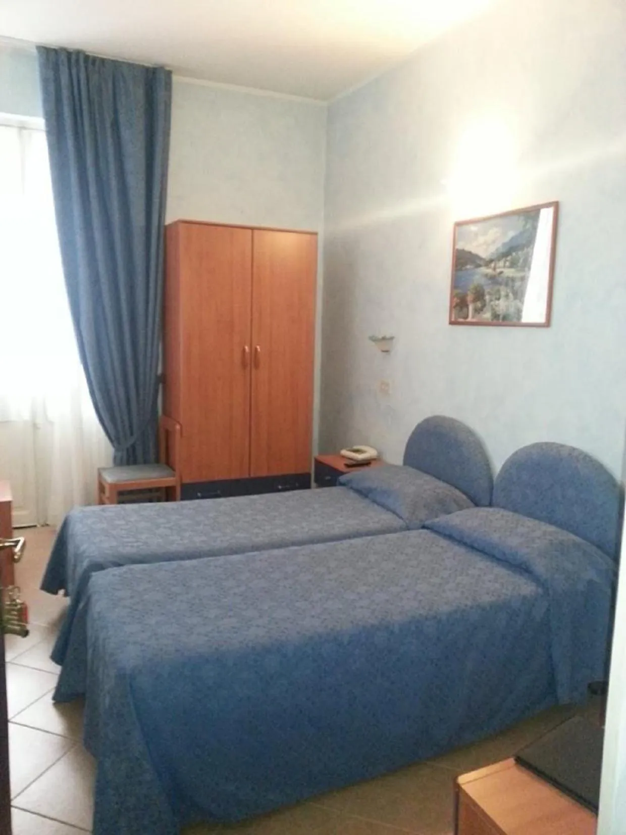 Bedroom in Hotel La Milanese