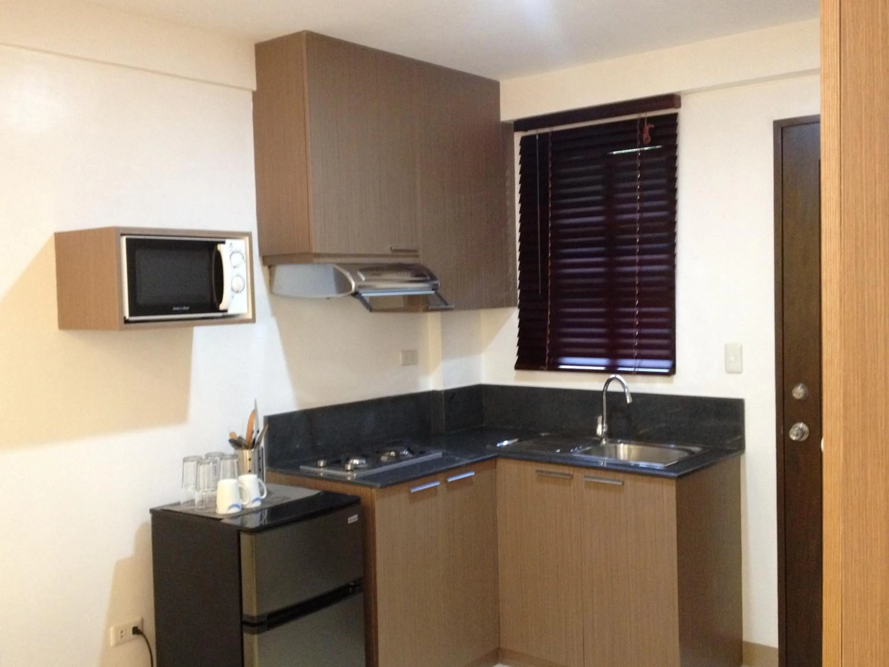 Kitchen or kitchenette in Anahaw Studio Suites