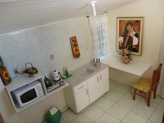 Kitchen or kitchenette in Pousada da Mari