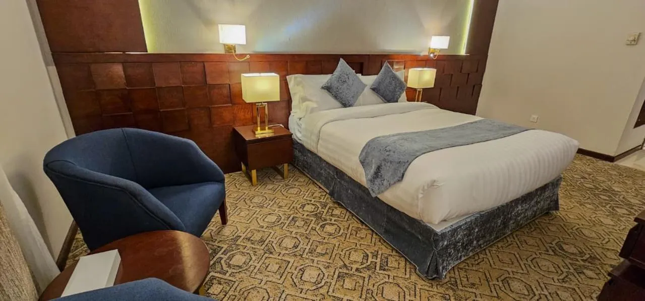 Bed in Jiwar Al Saha Hotel