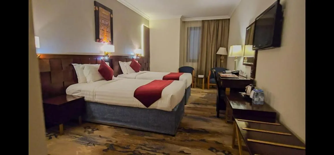 Bed in Jiwar Al Saha Hotel