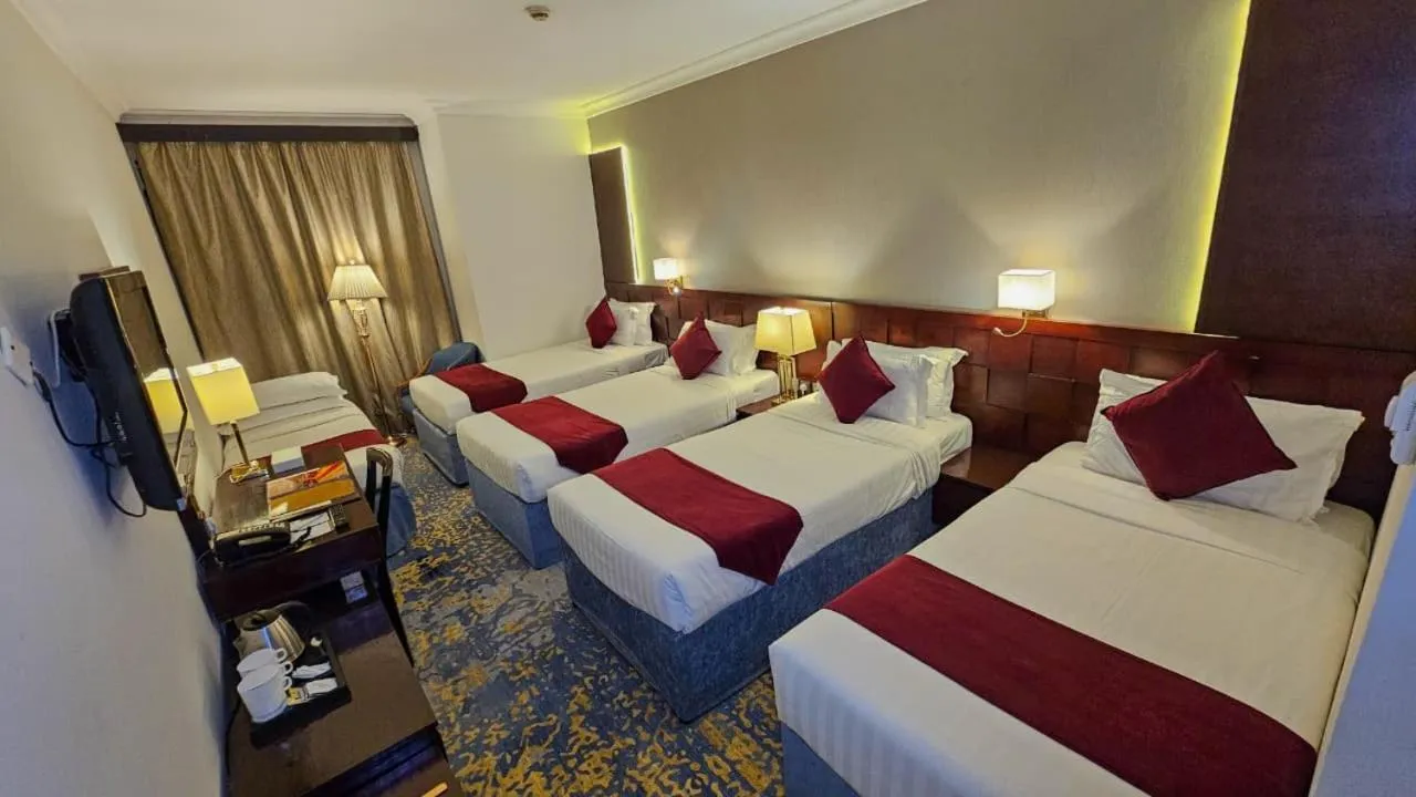 Bed in Jiwar Al Saha Hotel