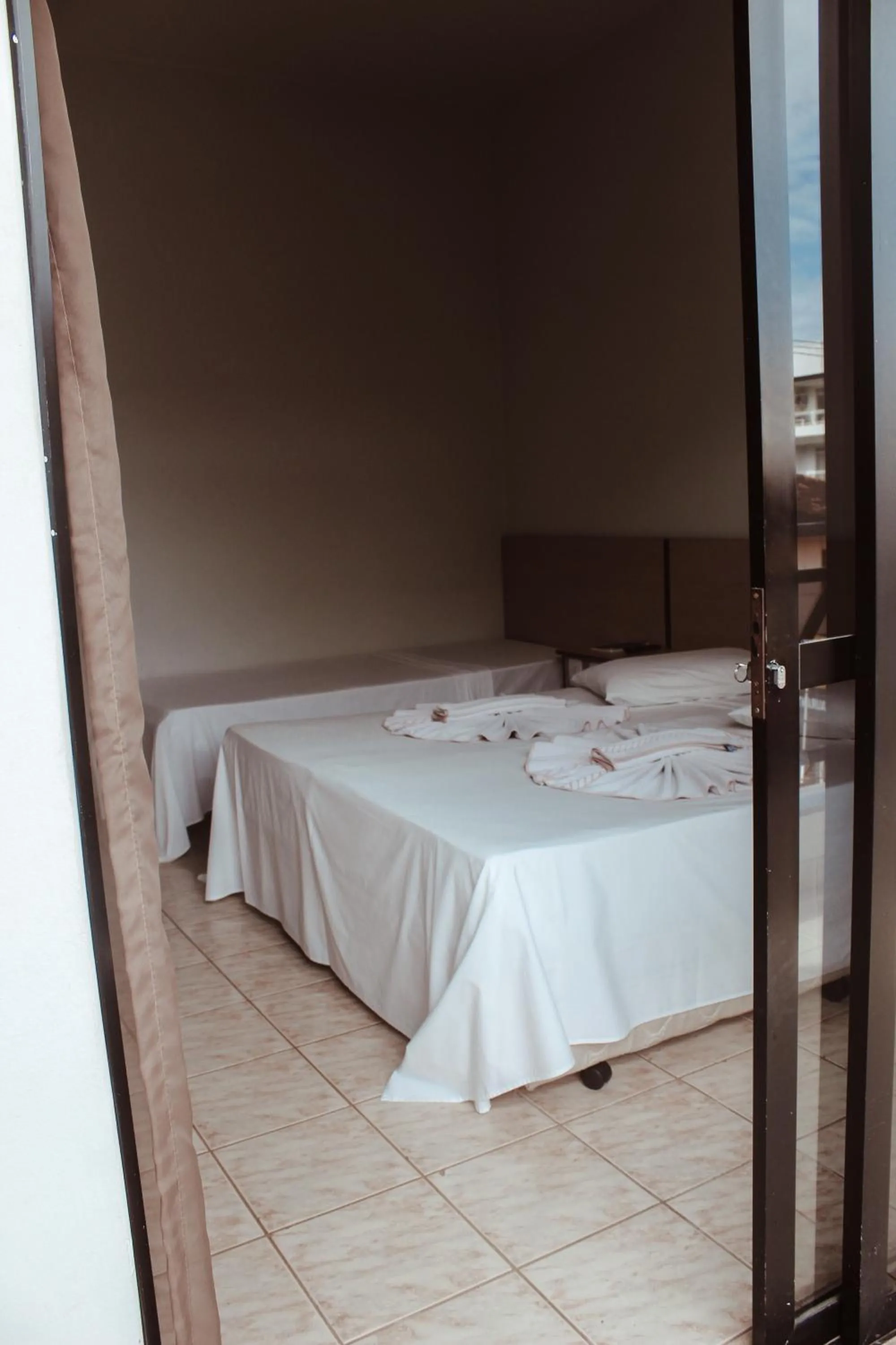Bed in Pousada Solar Meaipe