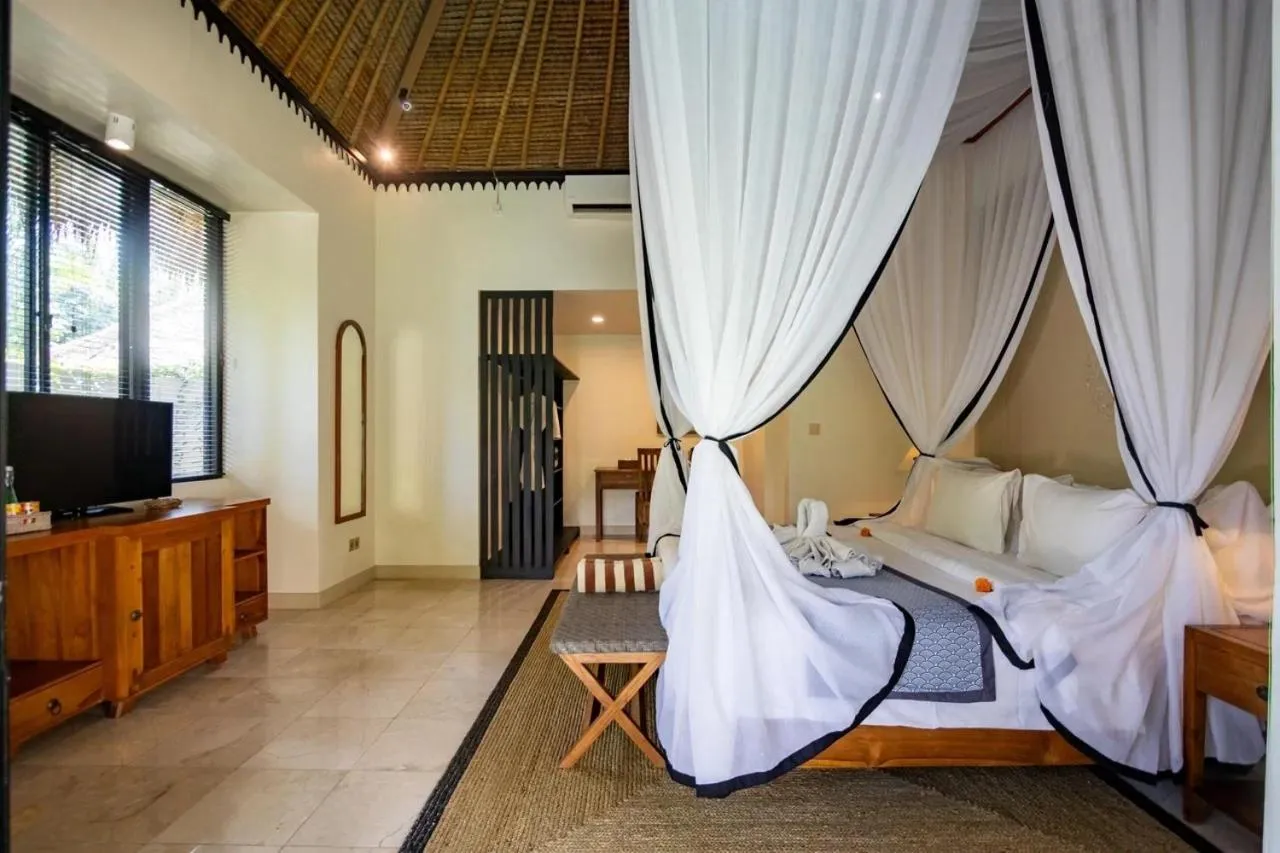 Bed in Mesari Hotel Ubud