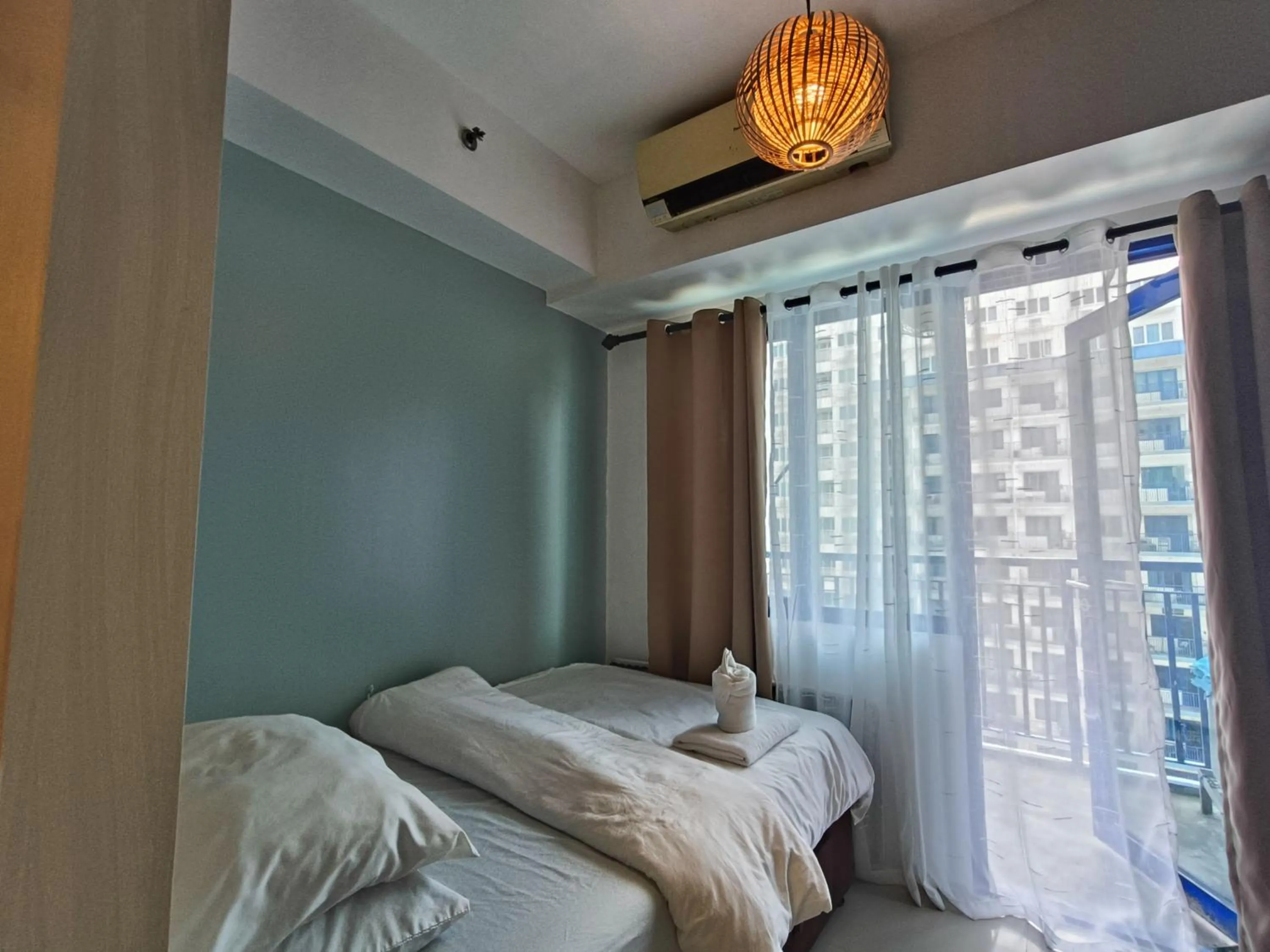 Bed in Premiere Haven MOA Staycation