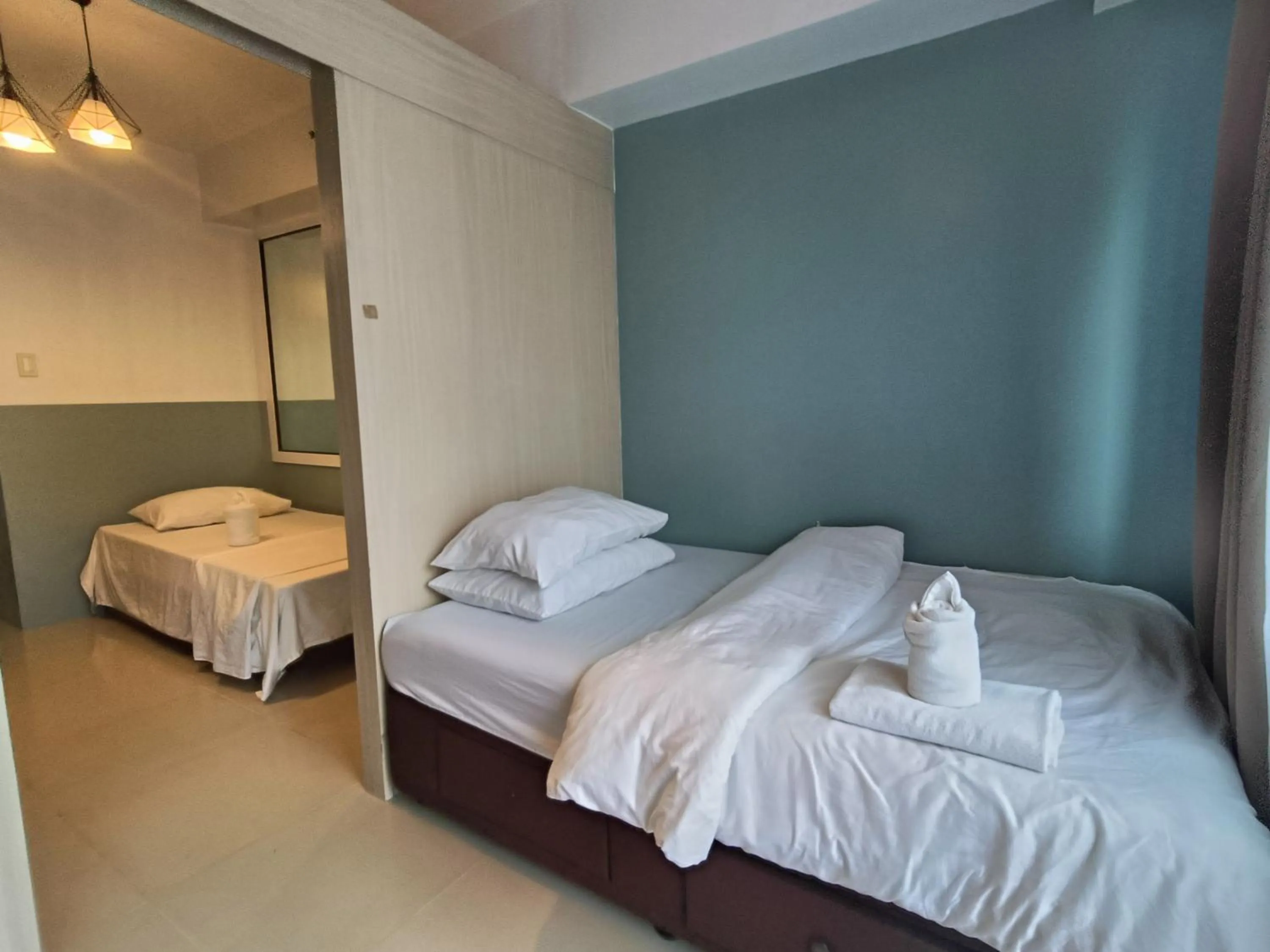 Bed in Premiere Haven MOA Staycation